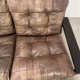 Living room sofa and brutalist armchairs in leather and wood, 70s, chalet style