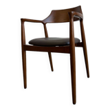 Curved wooden dining chair with brown leather seat