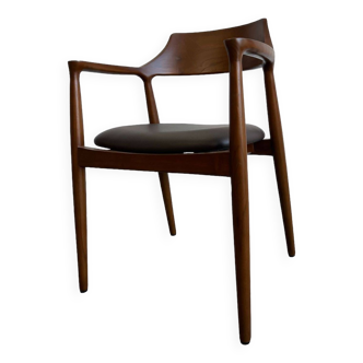 Curved wooden dining chair with brown leather seat