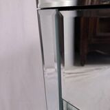 Bedside table covered with beveled mirrors on all sides