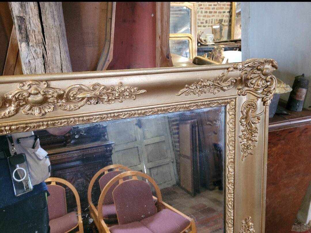 Antique gilded mirror from the 19th century, mercury mirror.