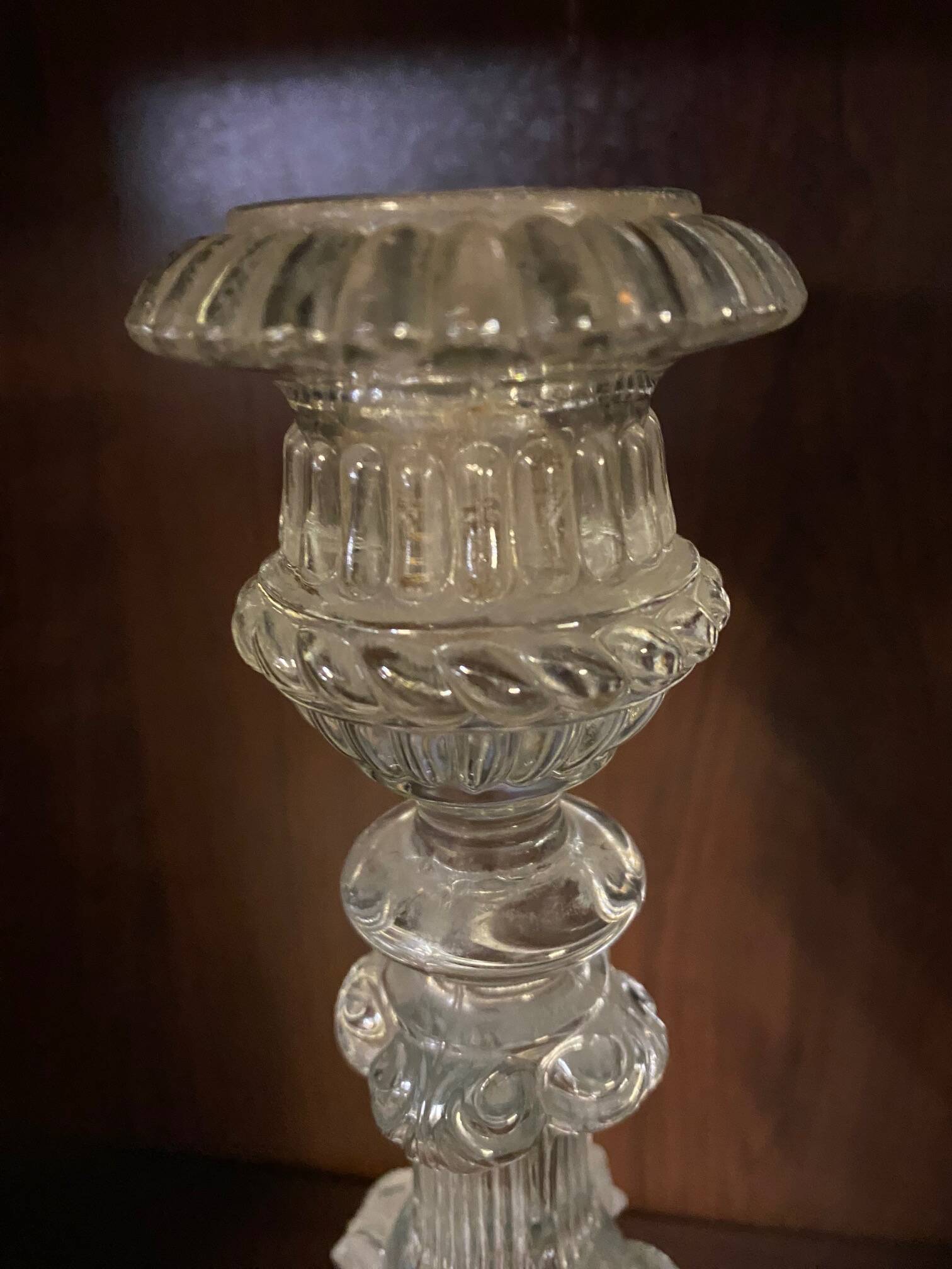 pair of cut glass candlesticks with lion and ram head decor, late 19th century