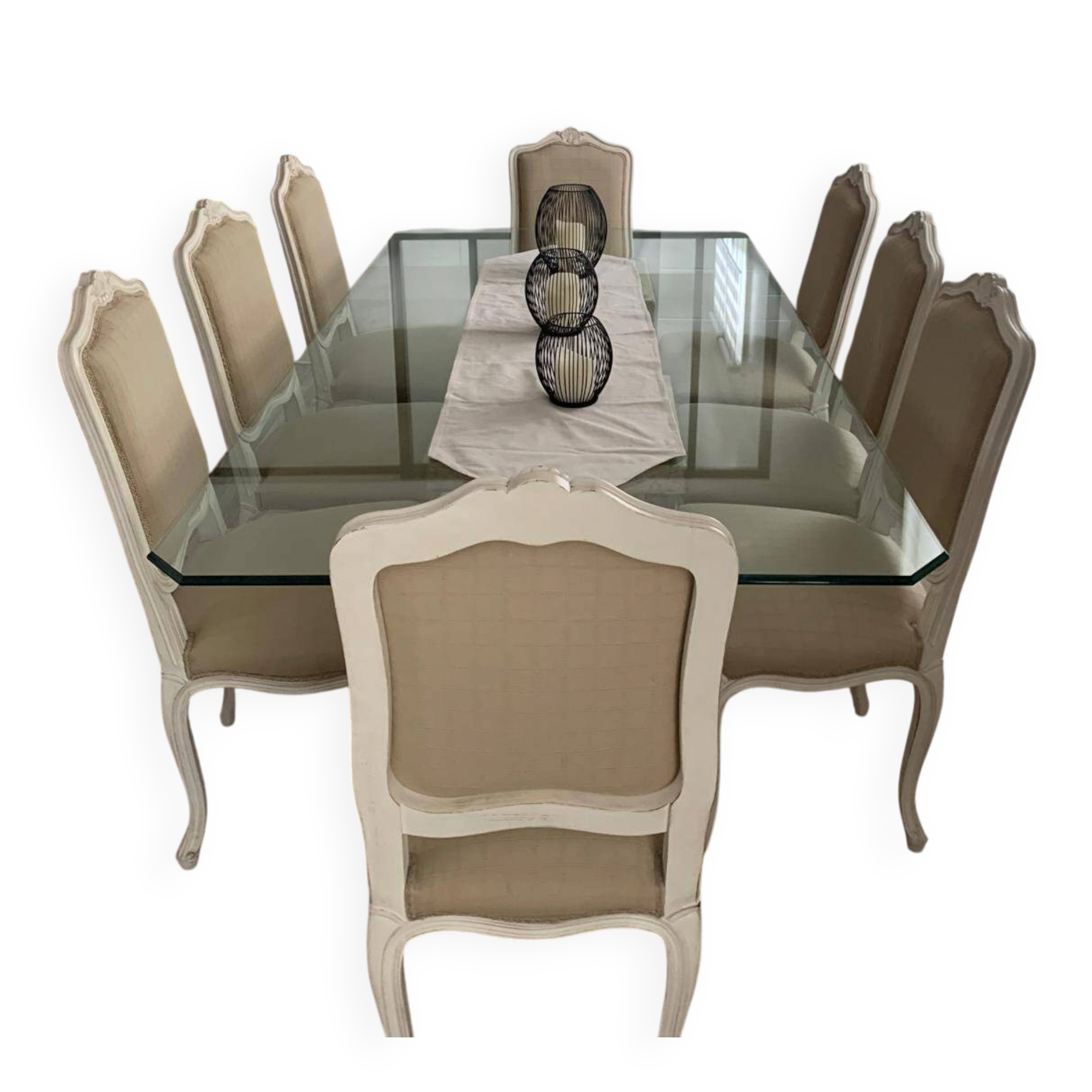 Table with a glass top and 8 chairs.