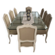 Table with a glass top and 8 chairs.