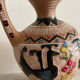 Clay pitcher with a bird head