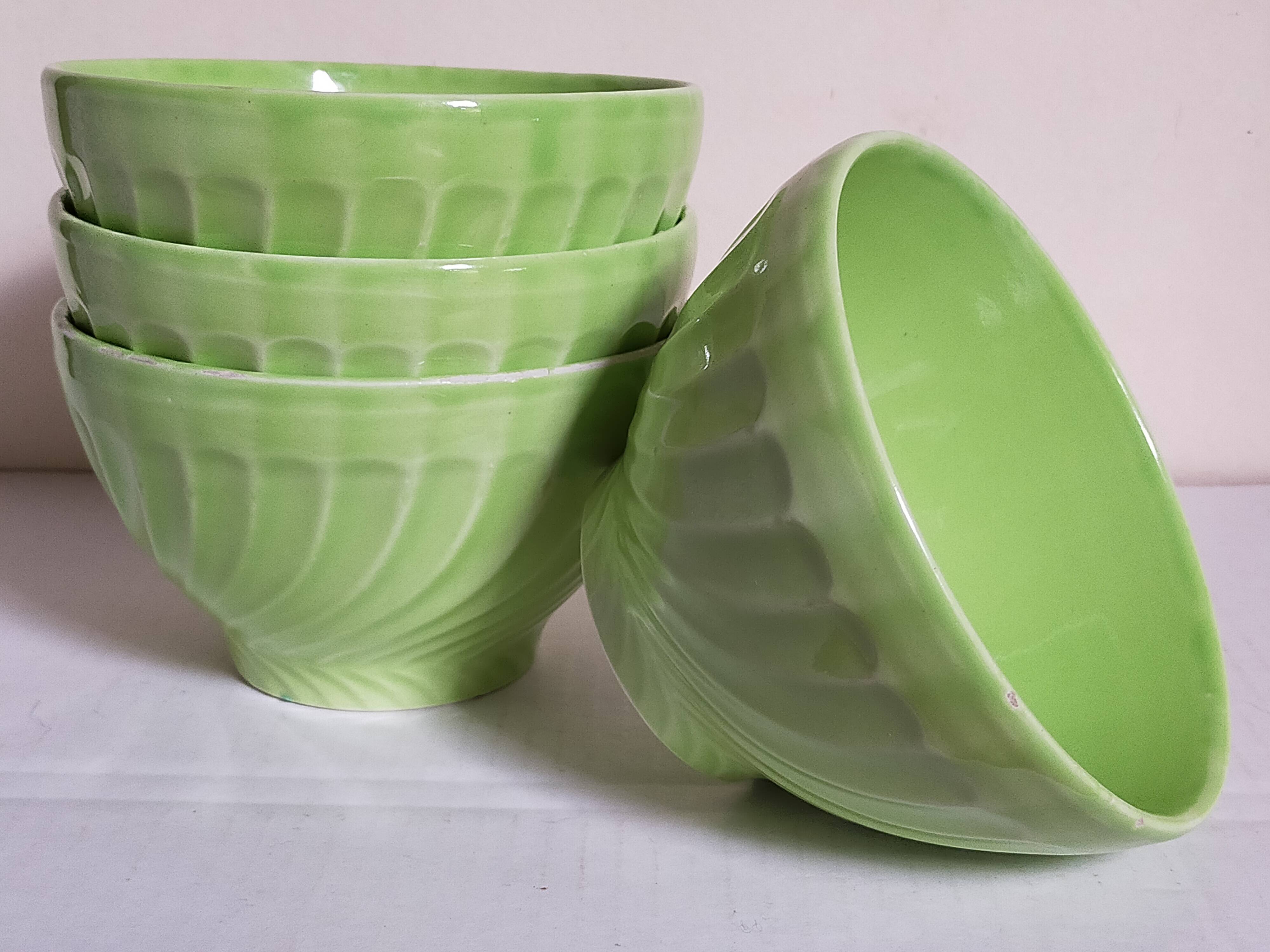 Four vintage spring green earthenware bowls