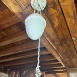 Sliding suspension chandelier with counterweight and smooth openwork plate