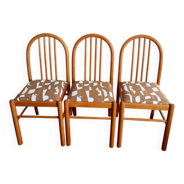 Three vintage-style pine and fabric chairs
