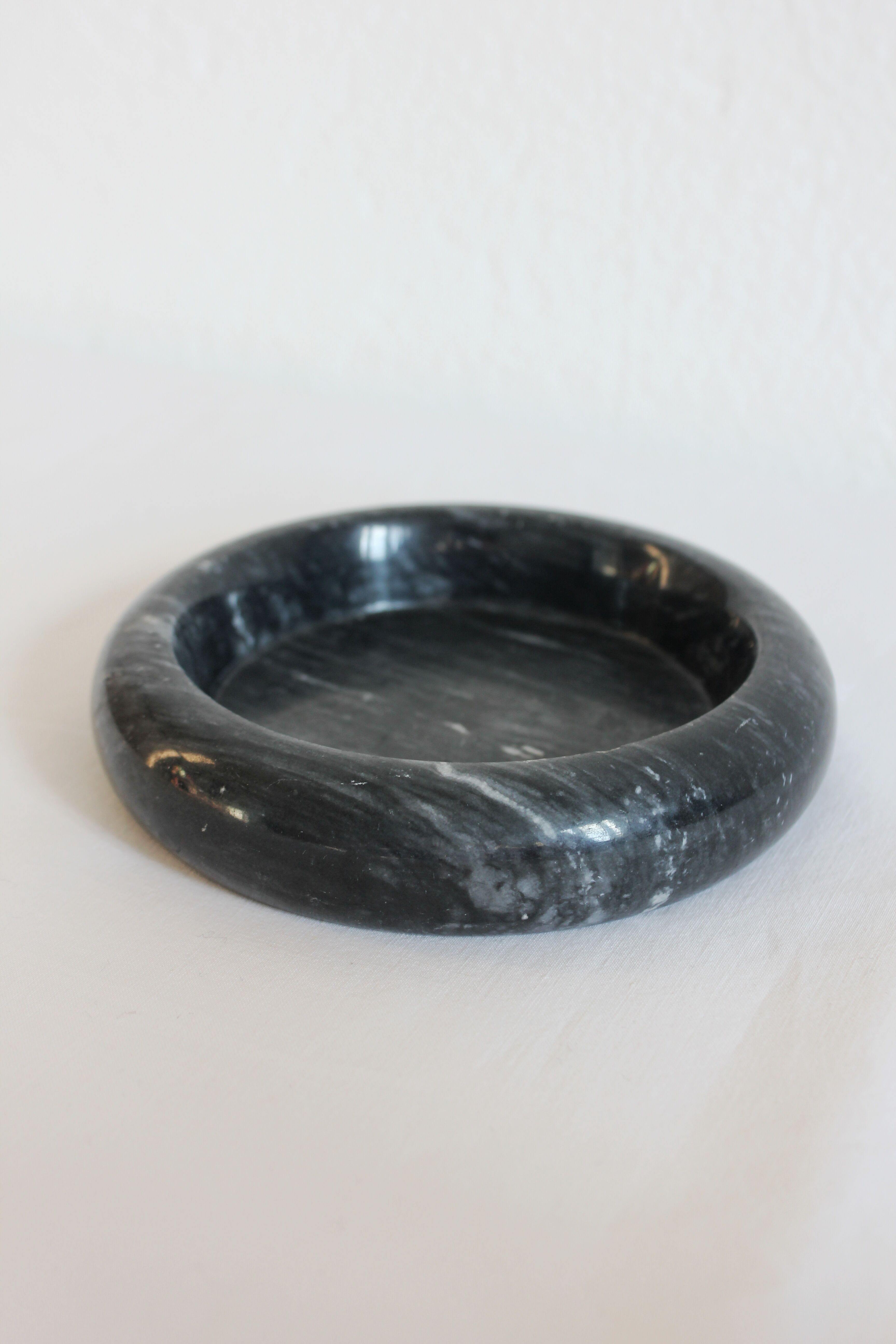 Ashtray or empty black marble pocket