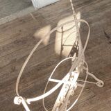 Old wrought iron cradle painted