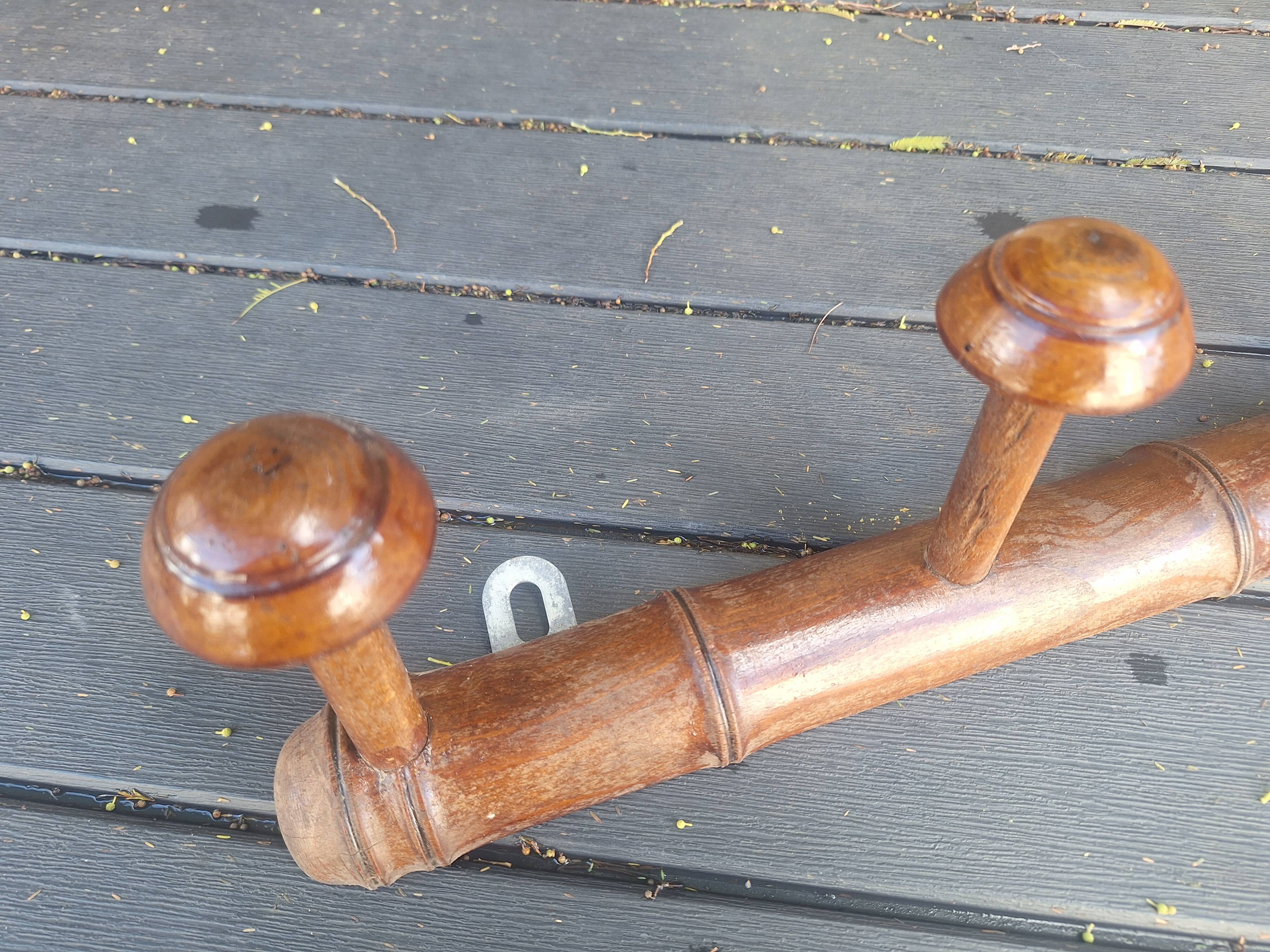Old wooden coat hook imitating bamboo.