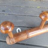 Old wooden coat hook imitating bamboo.