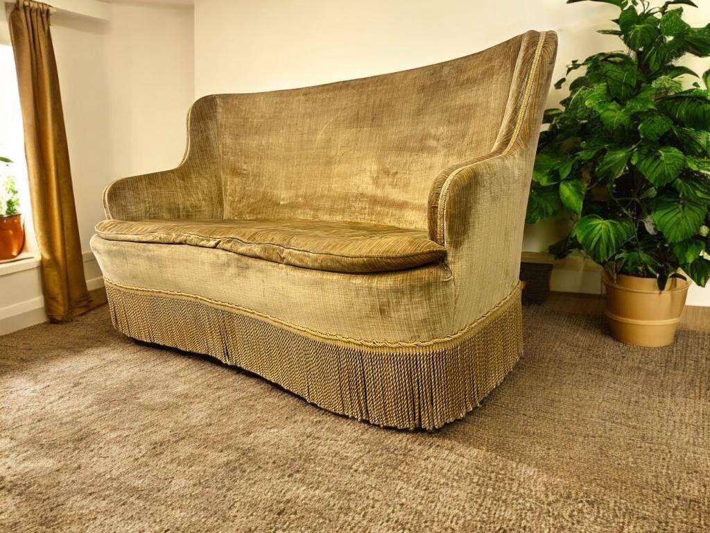 Vintage mustard yellow two-seater sofa with fringe