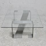 Coffee table with "kinetic" steel base and glass slab. Circa 1970.