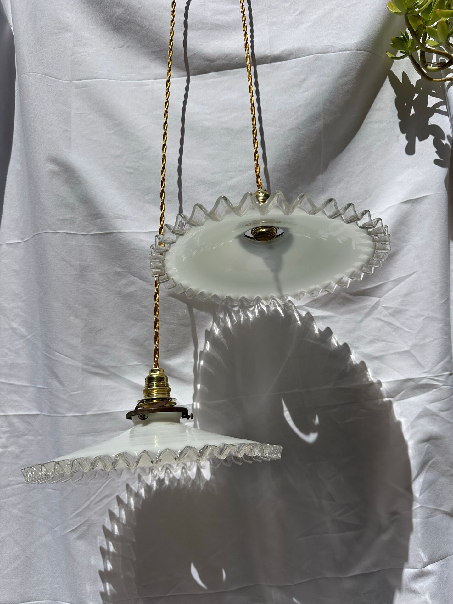 Vintage wavy opaline suspension pair with brass claw
