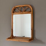 Arched rattan mirror with shelf. 1960.
