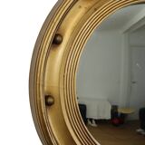 Grand miroir de majordome ancien avec cadre doré et hublot en forme d'œil de sorcière, années 1930