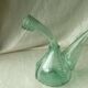 Blown glass carafe with a goat design.