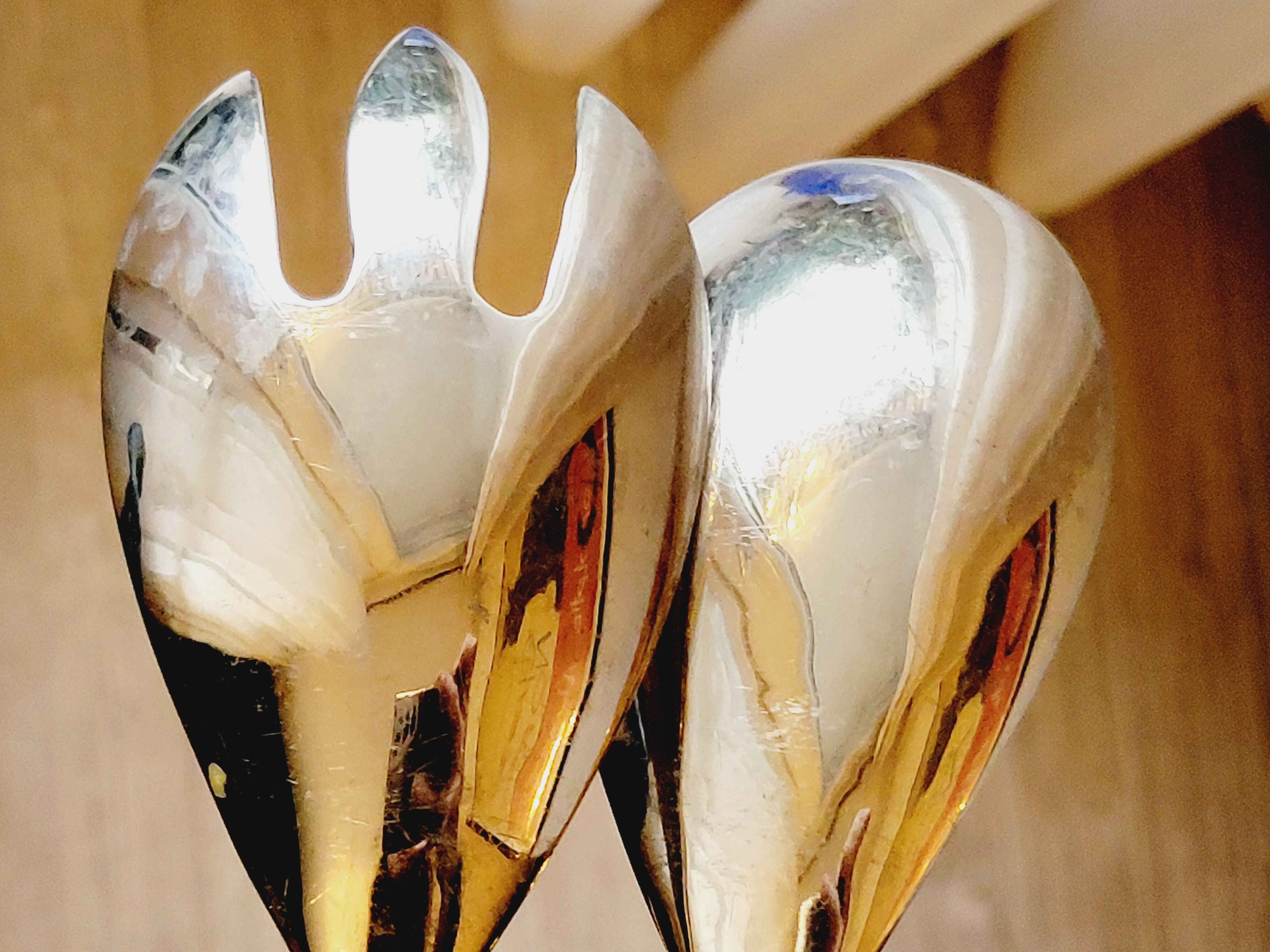 Set of salad serving cutlery in silver metal and resin