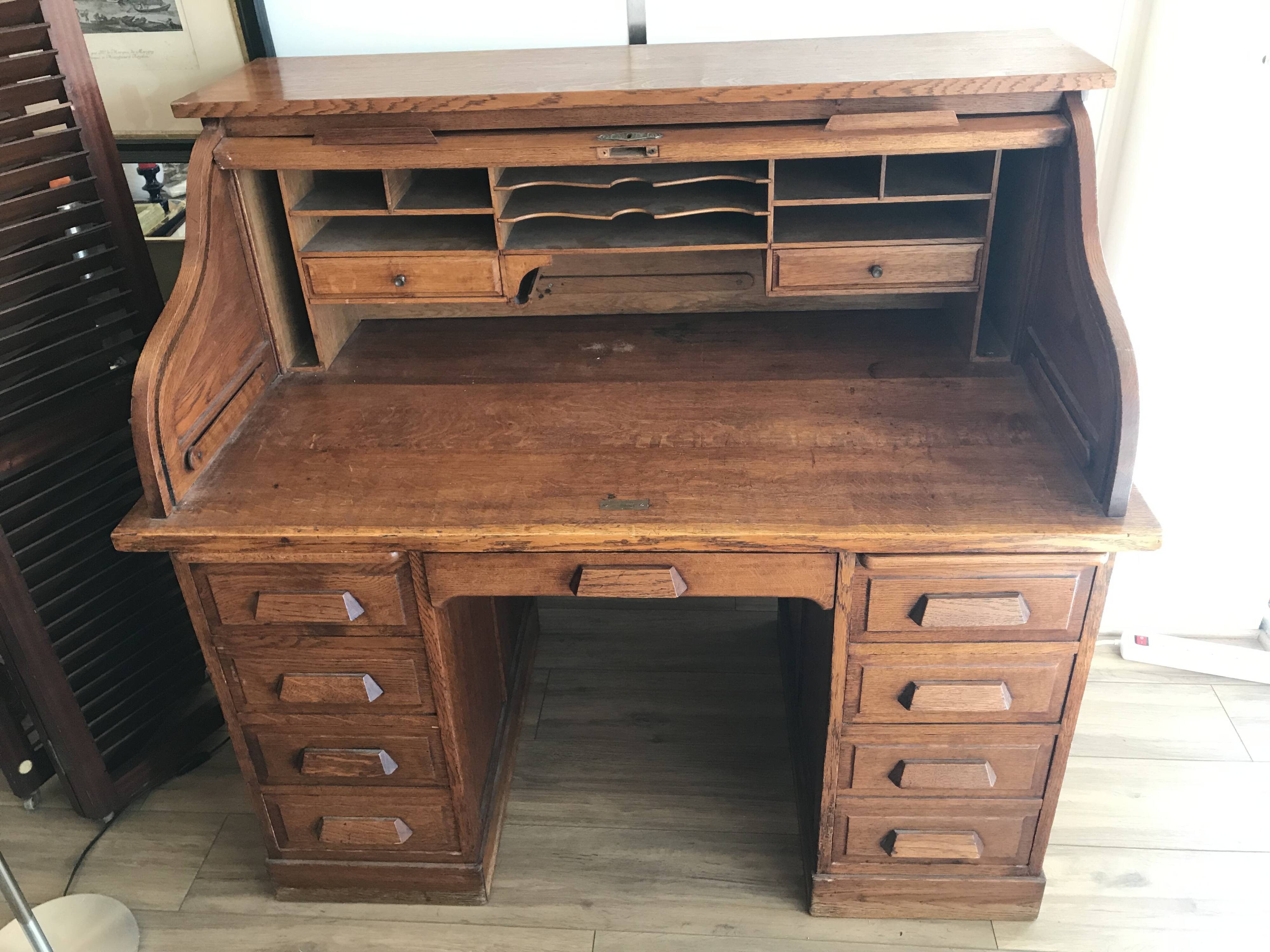 American desk with sliding shutter in solid oak, 20th century