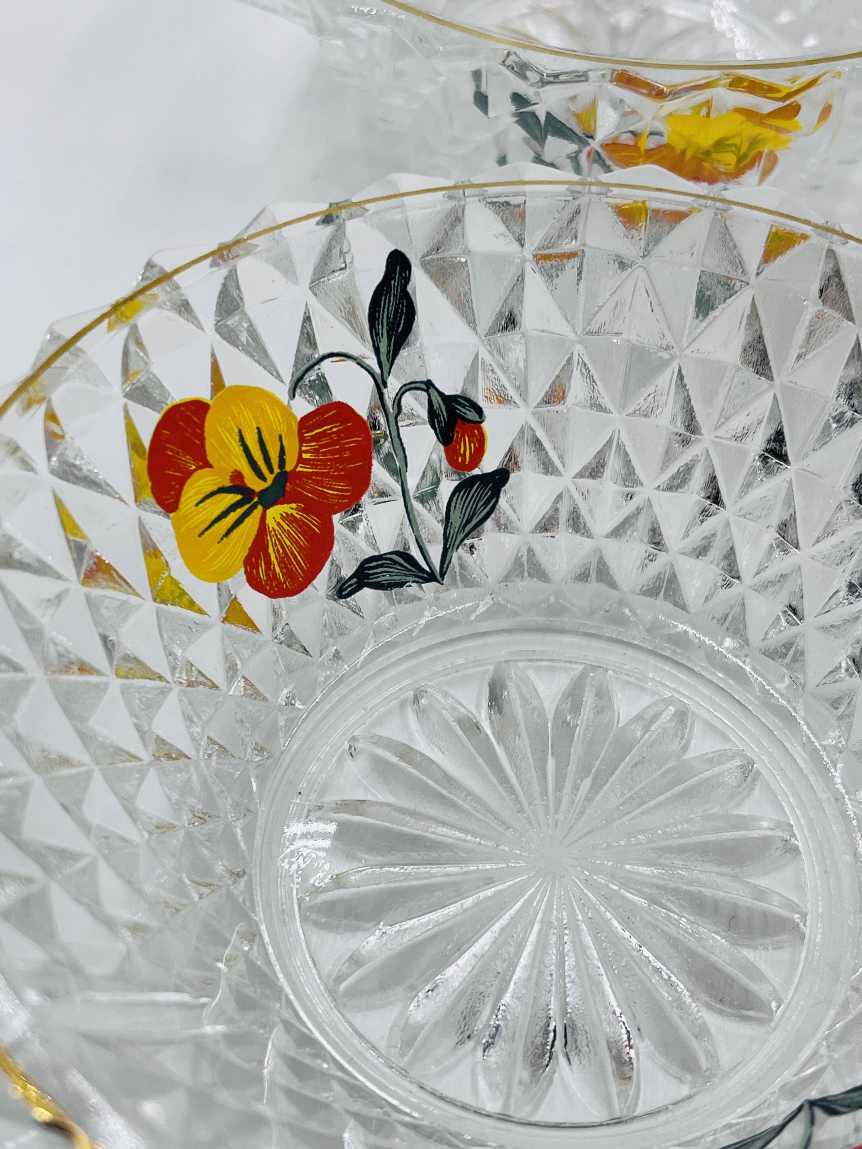 Vintage glass fruit salad serving set with a pansy design.