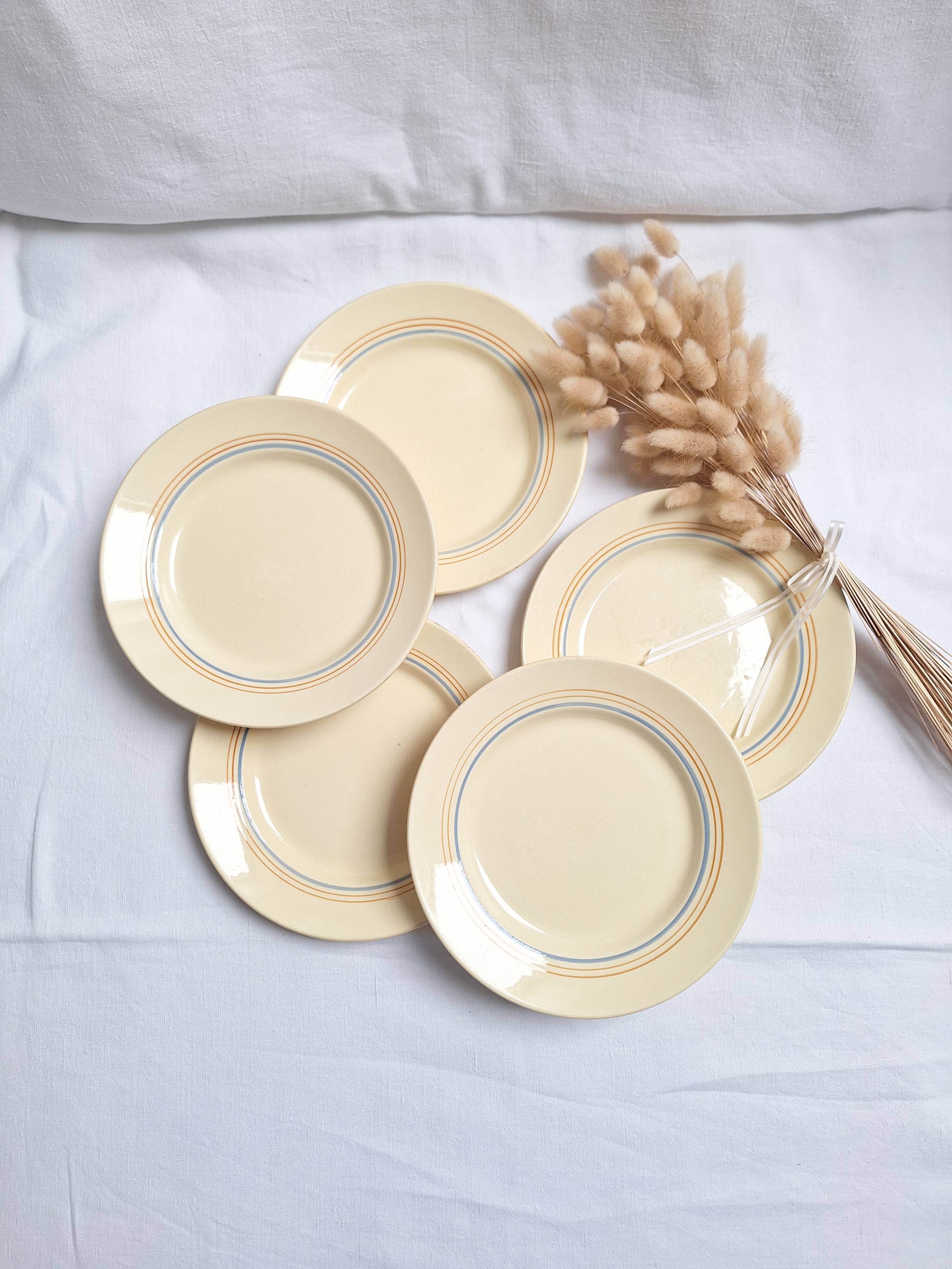 Vintage cream, orange and blue dinner plates.