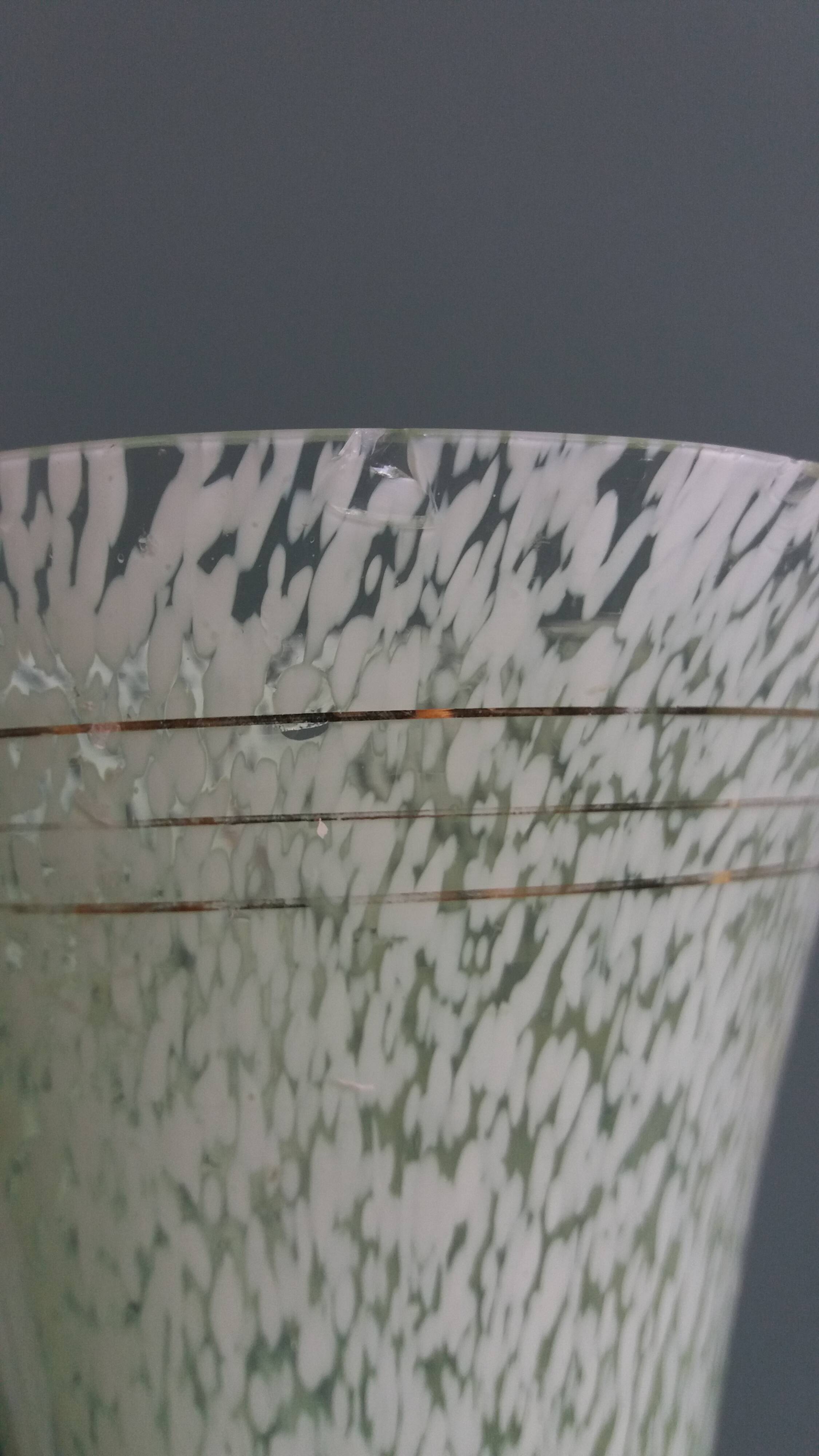 Green speckled glass vase from Clichy with gold threads.
