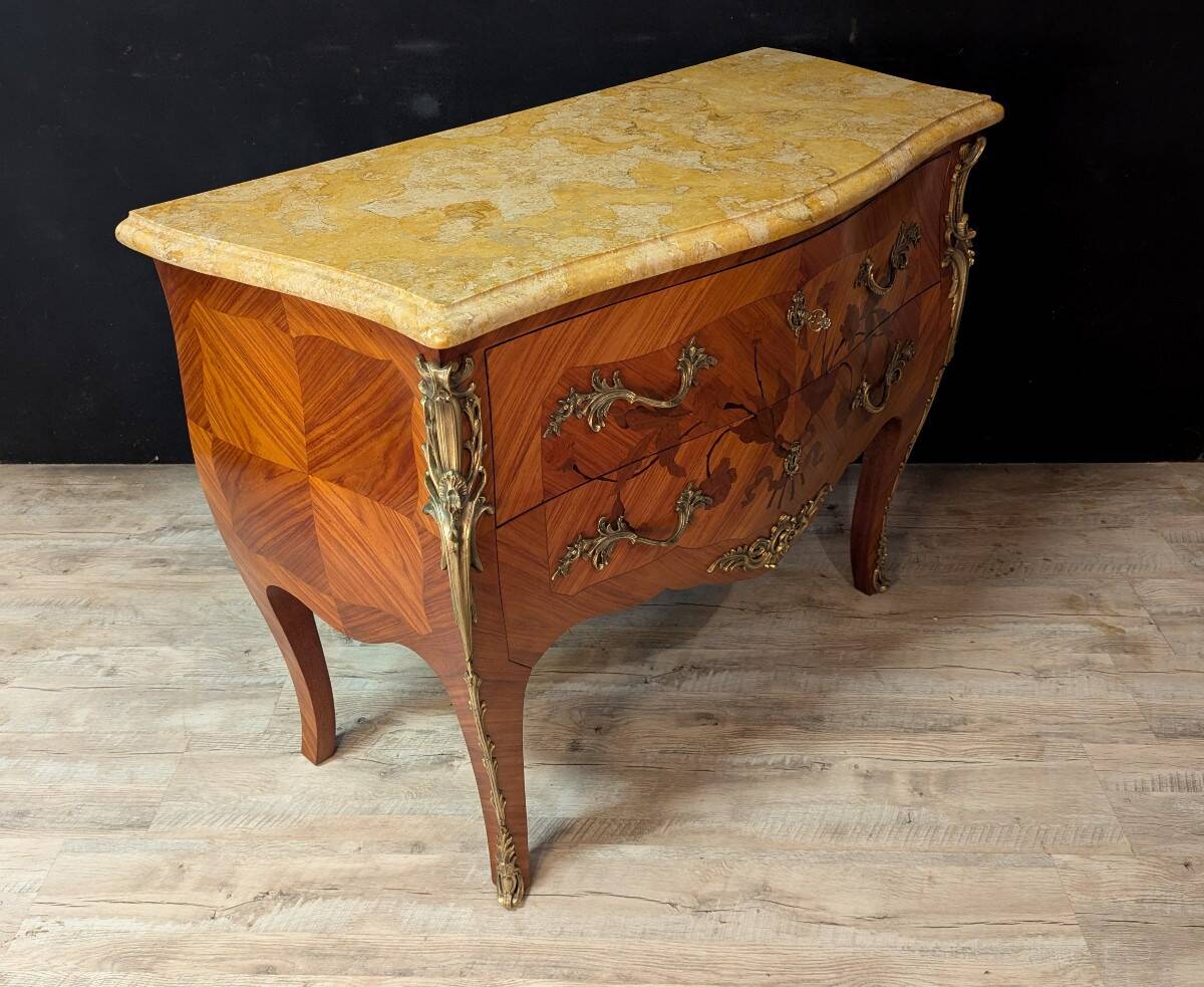 Louis XV style commode with marquetry and its pair of bedside tables.