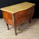 Louis XV style commode with marquetry and its pair of bedside tables.