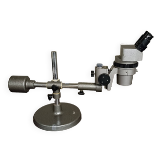 Olmpusvmt-2f stereoscopic microscope with base and adjustable foot.