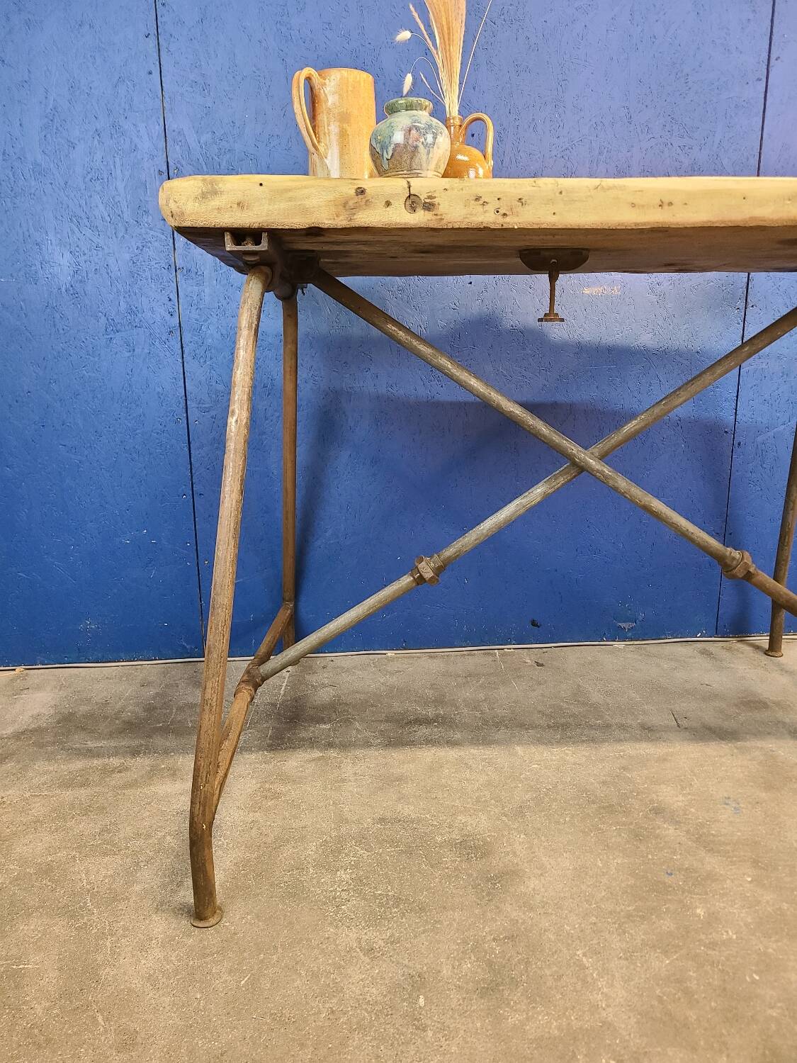 Vintage workbench circa 1930, folding metal leg.