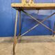 Vintage workbench circa 1930, folding metal leg.