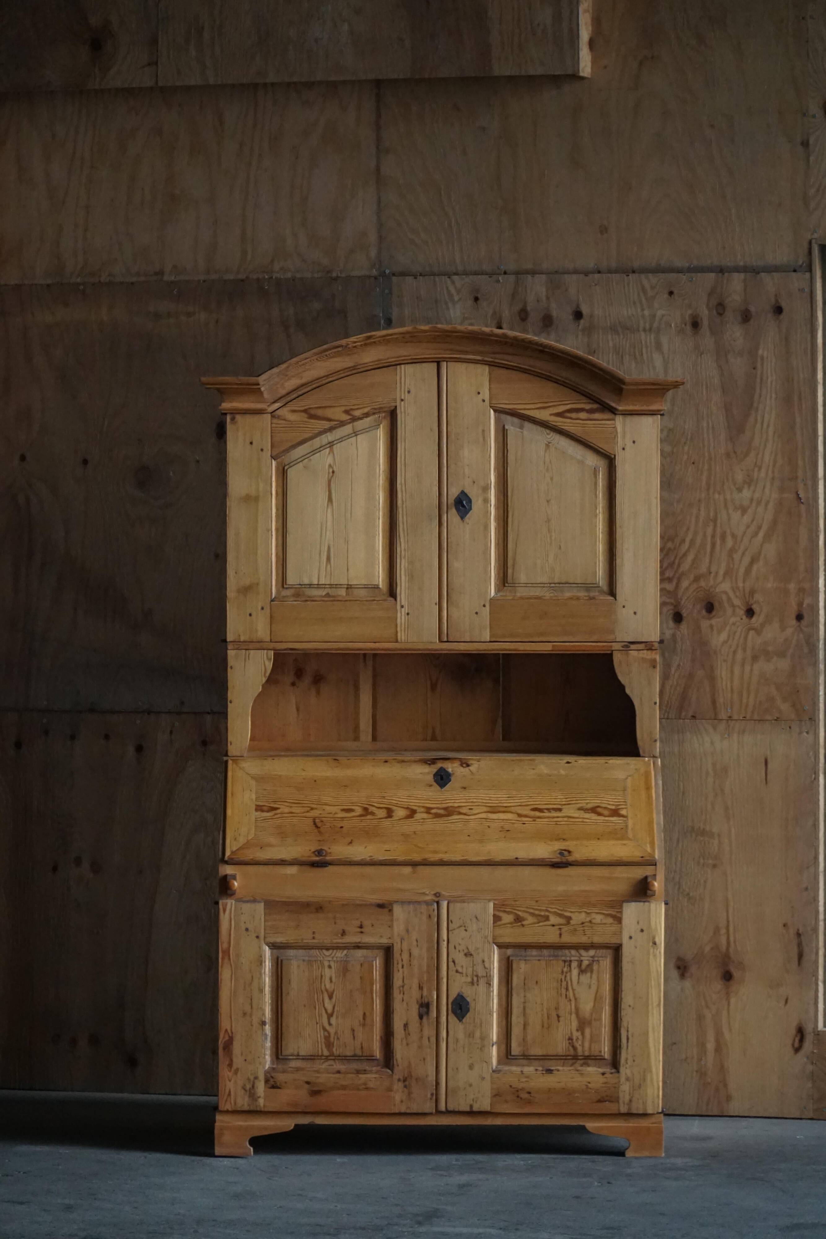 Old Danish secretary in pine with drop-down front and upper cabinet, mid-19th century.