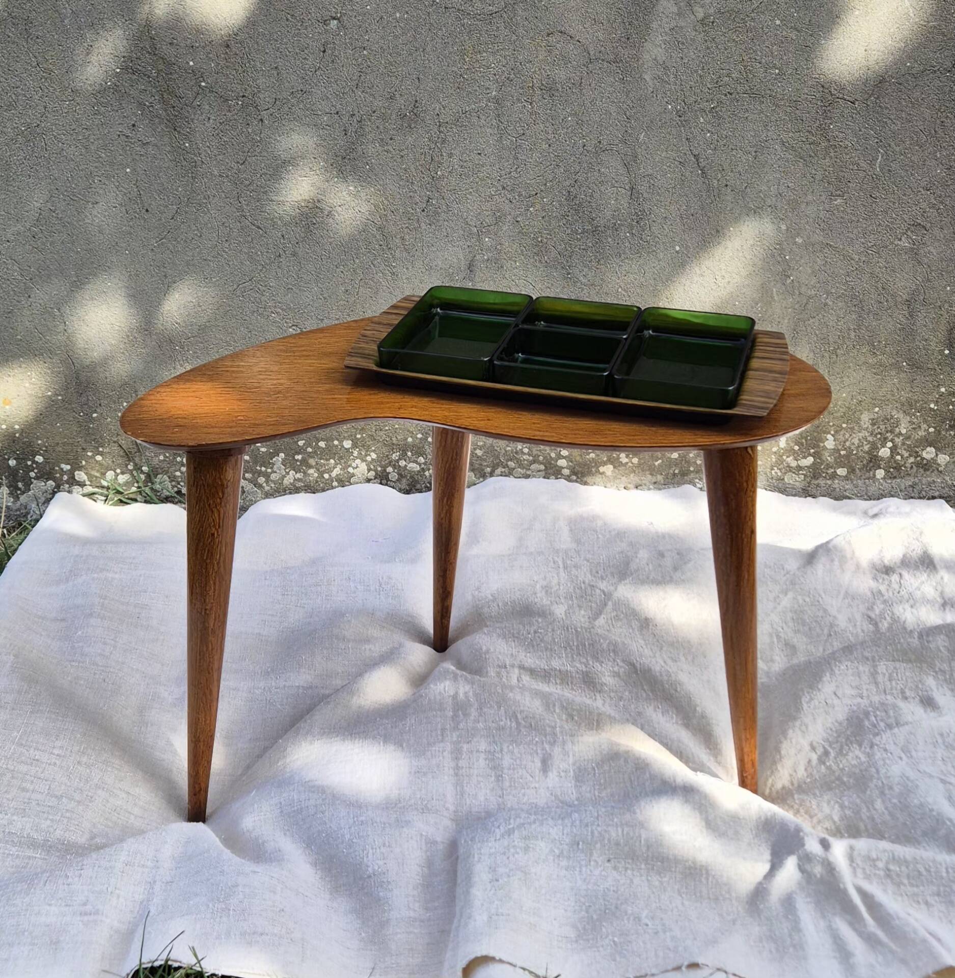 Vintage Scandinavian bean side table with wooden tapered legs.