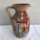 Former beige ceramic pitcher
