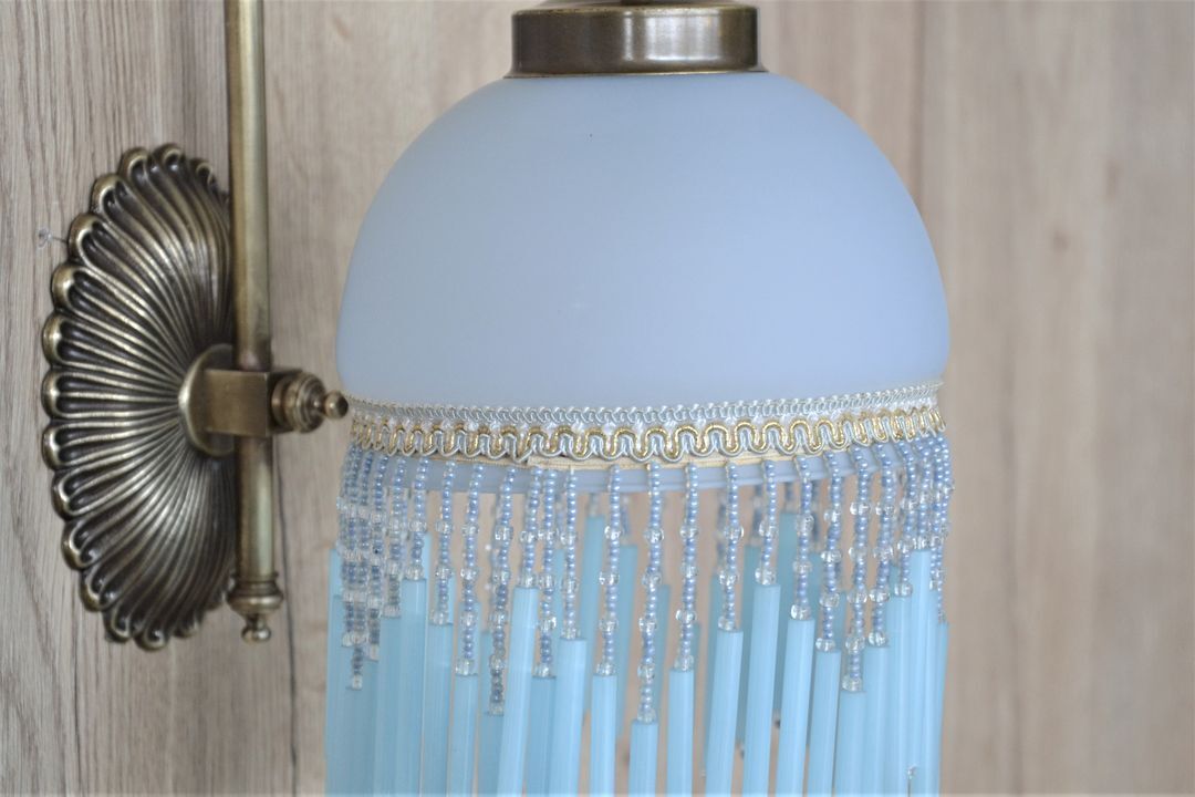 Blue wall lamp with pearl fringes