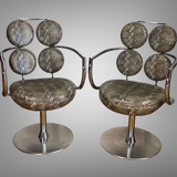 Pair of italian swivel armchairs in chrome-plated metal and piton imitation fabrics