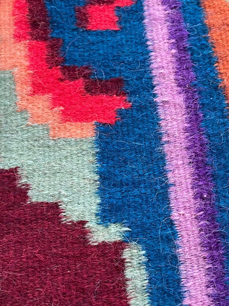 Rug with floral design on a blue background made by hand in Romania