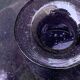 Bubble and purple blown glass decanter and faceted cut glass cap