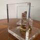 Vintage pair of bookends in lucite and brass from the 1970s.
