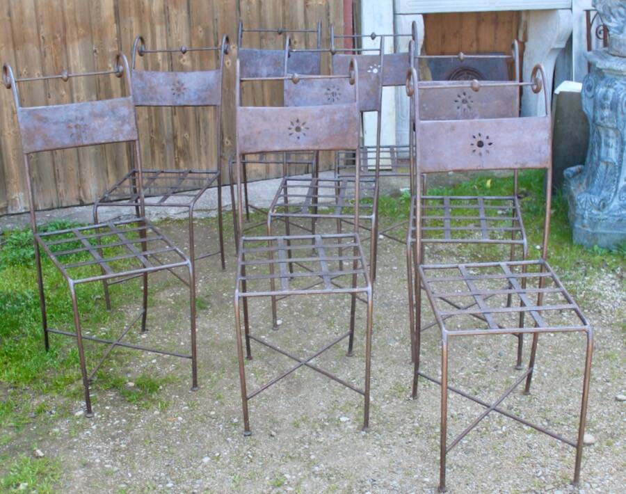 Series of 8 wrought iron garden chairs