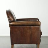 Characterful sheepskin design armchair with beautiful patina