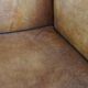 Antique armchair in patinated sheepskin
