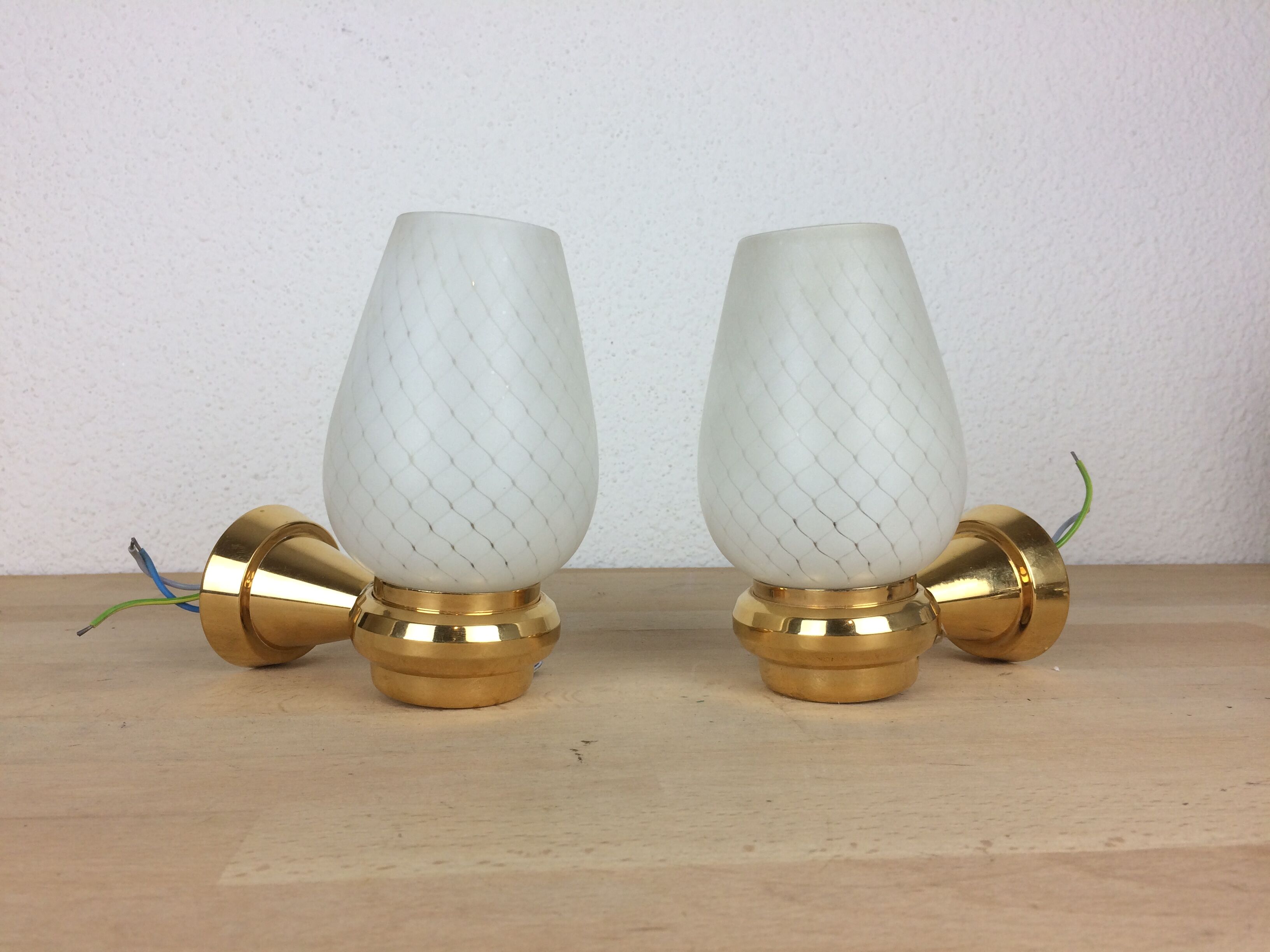 Pair of solid brass and white opaline wall lamps