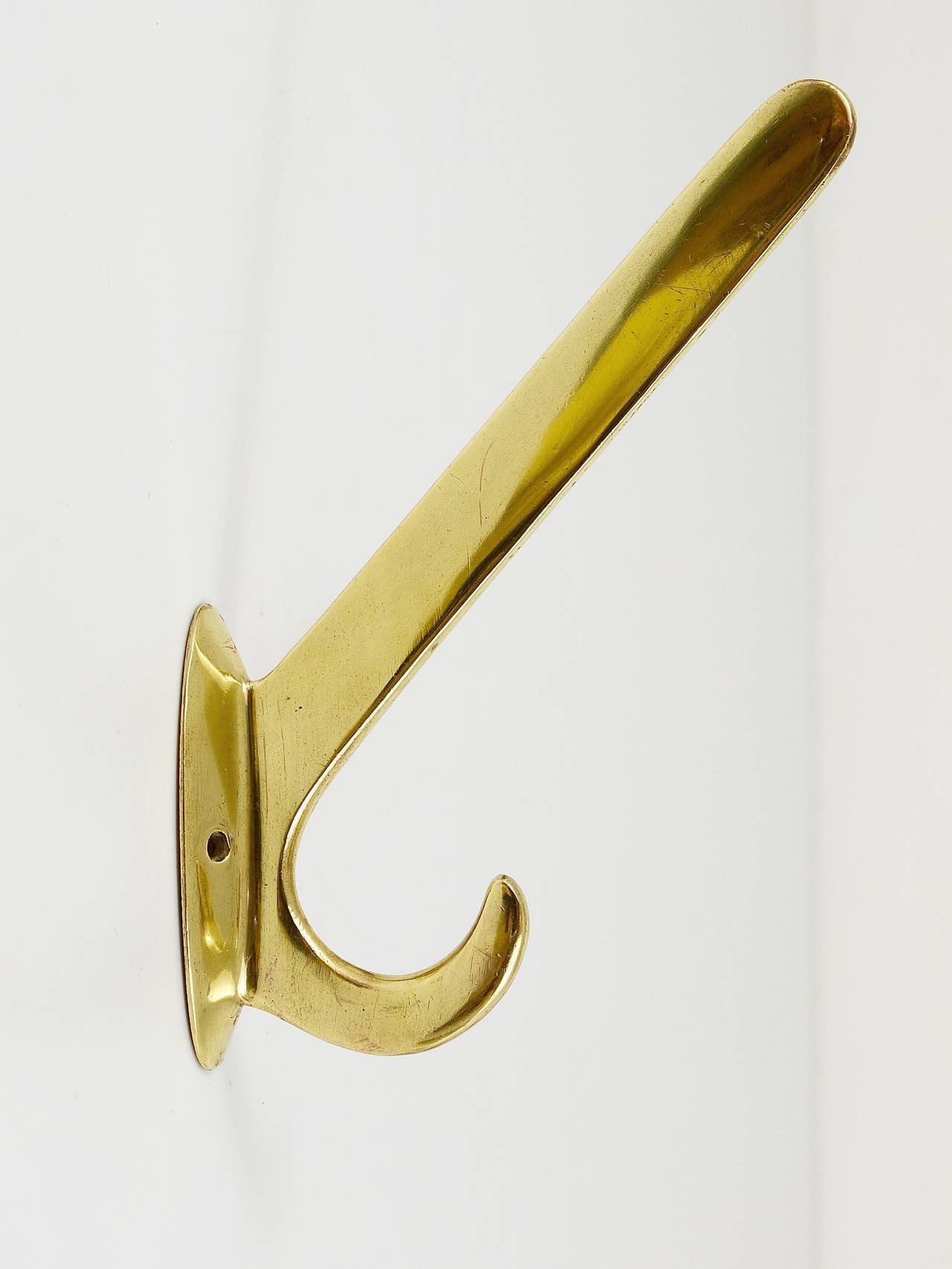 Four handmade brass wall hooks in Art Nouveau style, Austria, 1920s.