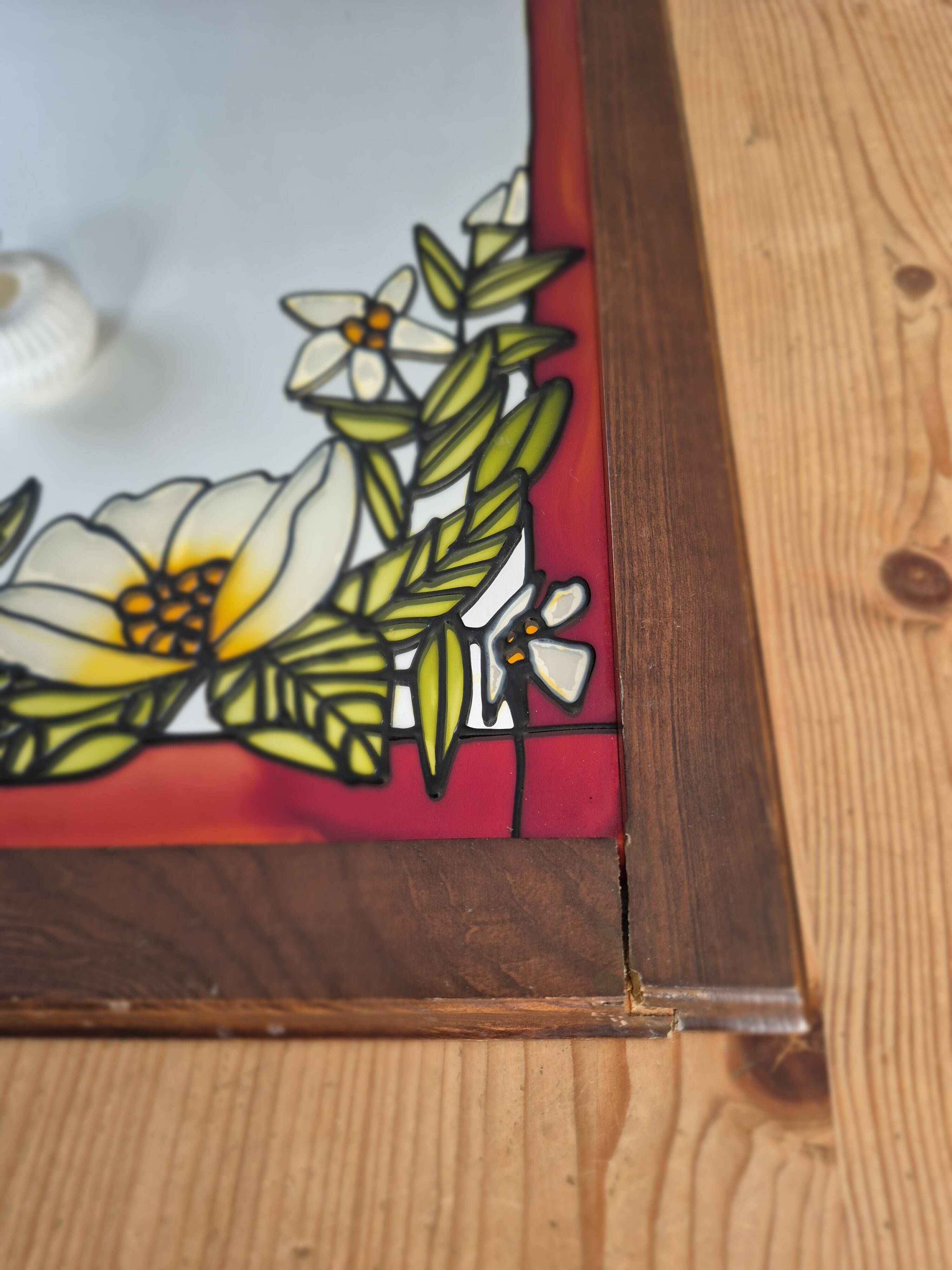 A pair of vintage stained glass style mirrors.