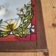 A pair of vintage stained glass style mirrors.