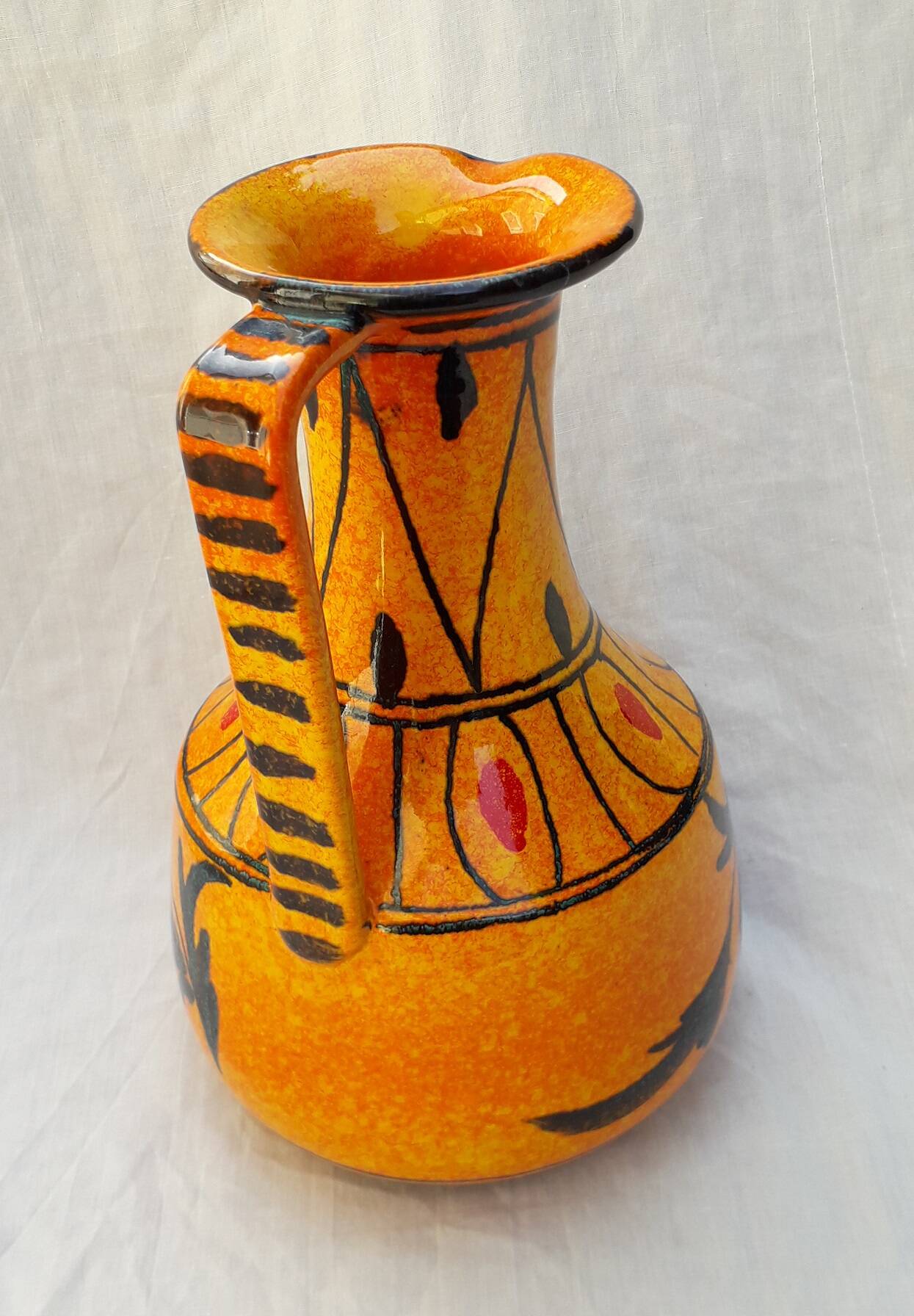 Orange ceramic jug