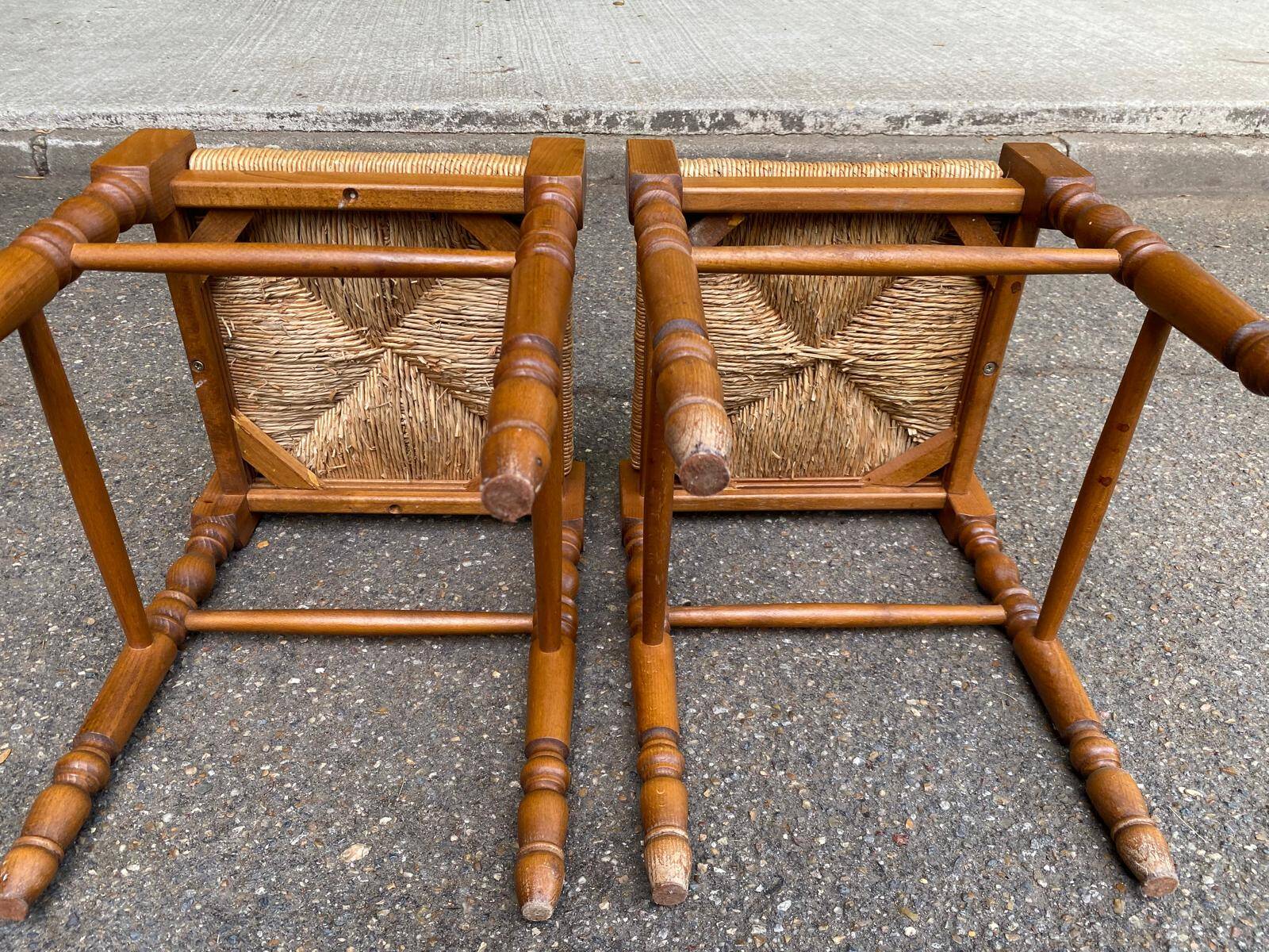 2 square stools made of carved solid wood with rush seats from the 1970s.