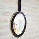 Vintage oval mirror with tartan decoration.